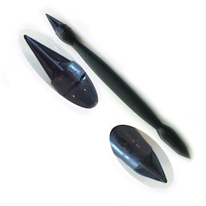 May include: A black plastic tool with a pointed tip on one end and a rounded tip on the other end. The tool is used for applying glue or other adhesives.