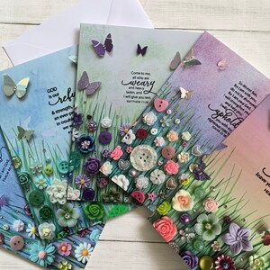 May include: Four greeting cards with inspirational quotes and colourful button embellishments. The cards feature a variety of colours, including blue, green, pink, and purple. The quotes on the cards include "God is our refuge", "Come to me all who are weary", "So do not fear, for I am with you", and "I will never leave you nor forsake you".