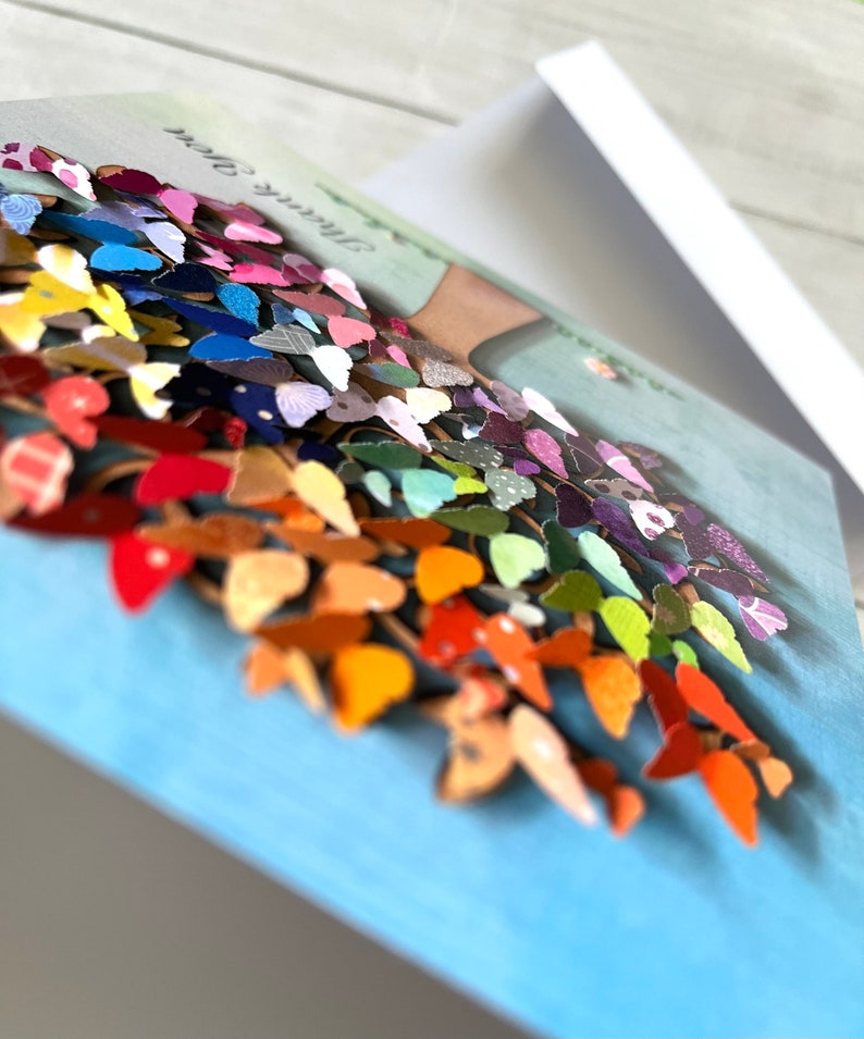 May include: A colorful card with a 3D paper butterfly tree. The tree is made of many different colored butterflies and the card says "Thank You".