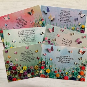 May include: Set of six inspirational cards with colourful floral backgrounds and butterflies. Each card features a different bible verse about faith, hope, and love. The cards are perfect for adding a touch of inspiration to your home or office.