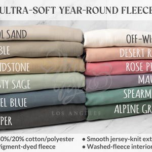 May include: A selection of fleece fabric in shades such as Cool Sand, Pebble, Sandstone, Dusty Sage, Steel Blue, Pepper, Off-White, Desert Rose, Rose Pink, Mauve, Spearmint, and Alpine Green. The image displays the text 'ULTRA-SOFT YEAR-ROUND FLEECE' and details about the fabric composition.