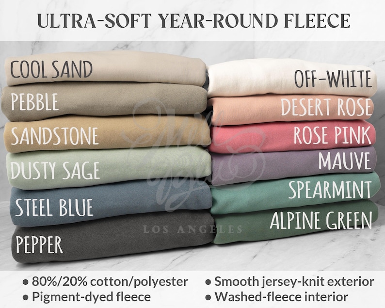 May include: A selection of fleece fabric in shades such as Cool Sand, Pebble, Sandstone, Dusty Sage, Steel Blue, Pepper, Off-White, Desert Rose, Rose Pink, Mauve, Spearmint, and Alpine Green. The image displays the text 'ULTRA-SOFT YEAR-ROUND FLEECE' and details about the fabric composition.