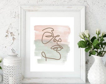 May include: A framed print with a minimalist line drawing of a face on a watercolor background. The background is a soft pink and green.