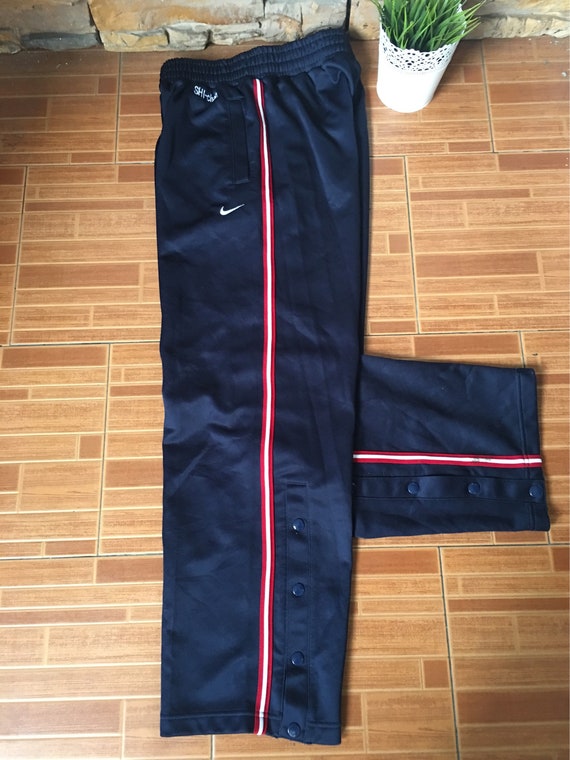 nike sweatpants with buttons on the side