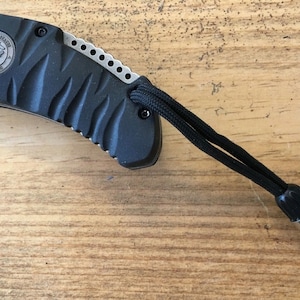 Knife & Zipper Lanyard... .45 Cal Shell Casing with 550 Para Cord