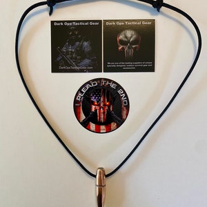 May include: A black paracord necklace with a bullet pendant. The necklace is adorned with a skull logo and the text "Dark Ops Tactical Gear".