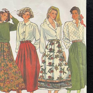 May include: Simplicity sewing pattern featuring illustrations of women's clothing. The pattern includes designs for skirts and blouses. The image shows a variety of styles, including floral and solid-colored skirts, and button-down shirts. The pattern number is 876.