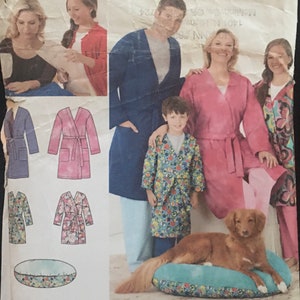 May include: A sewing pattern for a robe with a Simplicity Learn to Sew logo. The pattern includes instructions for basic sewing skills, such as choosing the right size, cutting out a pattern, stitching seams, applying a patch pocket, attaching a sleeve, making a belt, and inserting a zipper.