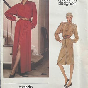 May include: Vogue American Designers sewing pattern featuring a Calvin Klein design. The pattern includes illustrations of two long dresses with belts. The cover has the Vogue logo and the text "calvin klein" at the bottom.