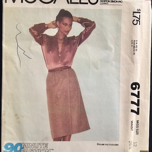 May include: A sewing pattern for a skirt with a 26 1/2 inch waist. The pattern is from McCall's and is number 6777. The pattern is for a size 12. The pattern includes a 90 minute fashion logo and the text "*90 Minutes average sewing time!"