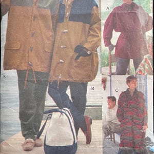 May include: Vogue Sport pattern 8180 featuring coats and a bag. The coats have toggle closures and color-blocked designs in shades of brown, green, and navy. The bag is white and navy. The pattern size is XS-S-M.