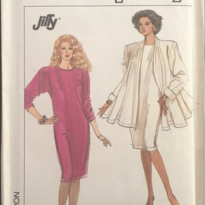May include: Simplicity sewing pattern 8731 for a dress and jacket. The pattern includes instructions for using an overlock or serger sewing machine. The dress is pink and the jacket is white.