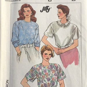 May include: Simplicity pattern 9055, size XL, Jiffy, for making a top with three different styles. The first style is a long-sleeved top with a blue and white floral pattern. The second style is a short-sleeved top with a white collar and a white and silver beaded necklace. The third style is a short-sleeved top with a floral pattern in shades of pink, purple, and green.