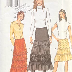 May include: A sewing pattern for a tiered skirt with three different styles. The pattern is for sizes 12, 14, and 16. The pattern is from Vogue Patterns.