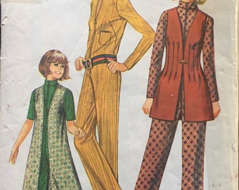 May include: A vintage sewing pattern for a women's jumpsuit and tunic with pants. The pattern is for sizes 8, bust 31 1/2 inches, waist 23 inches. The pattern is from Simplicity and is number 3972.