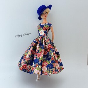 green emerald velvet dress Amazon.com: Barbie Fashionistas Raquelle Doll with Flower Print Dress and  Red Bodice : Toys & Games main image 0