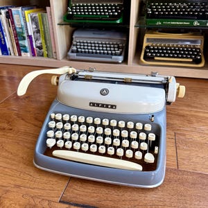 Serviced 1960 Alpina SK 24 Typewriter with QWERTY Keyboard, Congress Elite Typeface and Case