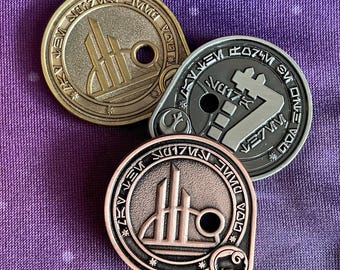 Monedas de Til the Spire
