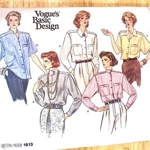 May include: Vogue's Basic Design pattern 1813. Illustration of women's blouses with various styles: short-sleeved denim, white, yellow, gray, and pink striped. Each blouse has pockets and is paired with pants or a skirt. The pattern is on a white background.