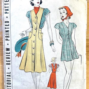 May include: Vintage sewing pattern featuring illustrations of women's dresses. The main design is a button-down dress with a contrasting bodice and pockets. Additional designs include a checkered dress and a red dress. The pattern number is 9667.