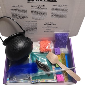 May include: A magical potion kit with a black cauldron, colourful bath fizz, and a wooden spoon. The box is labelled "DO NOT EAT" and contains powders, crystals, and a feather. The set is designed for a fun, sensory experience, with ingredients in sachets.