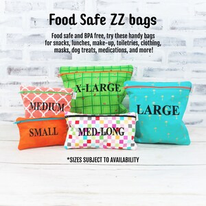 May include: Five reusable zippered bags in different sizes and colors. The bags are labeled "Small", "Medium", "Med-Long", "Large", and "X-Large". The text "Food Safe ZZ bags" is at the top of the image. The text "*Sizes subject to availability" is at the bottom of the image.