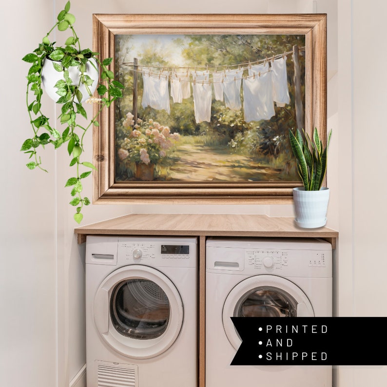 Charming laundry room art: Sheets on clothesline amid floral landscape, a modern print capturing serene spring scenery.
