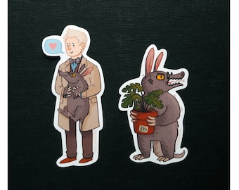 May include: Two stickers featuring cartoon illustrations. The first sticker shows a man in a beige coat holding a small, brown, furry animal. The second sticker shows a grey, furry creature with a plant in a pot. The creature is wearing glasses and has a surprised expression.