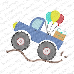 May include: A blue monster truck with large tires drives on a brown dirt road. The truck is carrying a gift box and has three balloons tied to the back. The balloons are red, yellow, and blue.