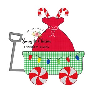 May include: A red and white candy cane wagon with a red sack of gifts and a string of lights. The wagon has a green and white checkered design and candy cane wheels. The text "Sawyers Charm Embroidery Designs" is on the side of the wagon.