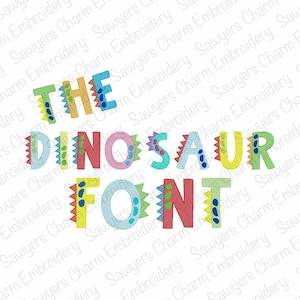May include: The Dinosaur Font embroidery design features colorful letters with dinosaur-themed accents. The letters are outlined in black and have a playful, whimsical style.