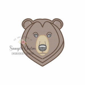 May include: Embroidered brown bear face with a black nose and gray eyes. The bear's fur is a light brown color.