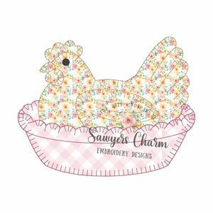 May include: A fabric chicken with a floral pattern, nestled in a pink gingham basket. The chicken features yellow, pink, and white flowers. The basket has a pink and white checkered design. The text reads "Sawyers Charm Embroidery Designs".