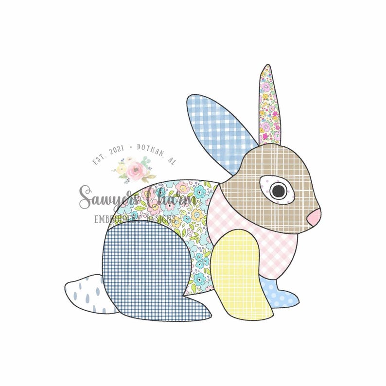May include: A patchwork bunny illustration with various patterns and colours. The bunny features a tan head, pink nose, and a mix of blue gingham, floral, and yellow patterned fabrics. The text "Sawyer's Charm" is visible.