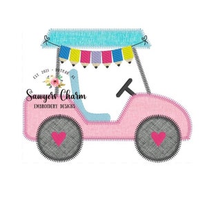 May include: A pink and blue toy jeep with a blue canopy and a string of colorful flags with pencils hanging from them. The jeep has two gray wheels with red hearts on them. The text "Sawyers Charm Embroidery Designs" is on the side of the jeep.