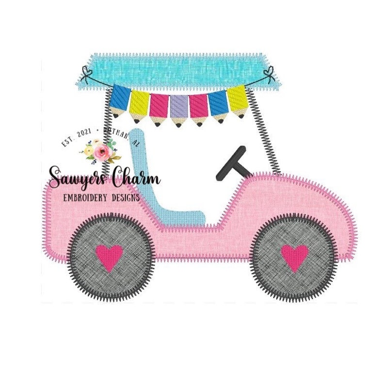 May include: A pink and blue toy jeep with a blue canopy and a string of colorful flags with pencils hanging from them. The jeep has two gray wheels with red hearts on them. The text "Sawyers Charm Embroidery Designs" is on the side of the jeep.