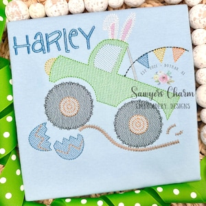 May include: A green monster truck with bunny ears and a broken egg behind it. The truck has a banner that says "Sawyers Charm Embroidery Designs Est. 2021 Dothan, AL". The name "Harley" is stitched above the truck.