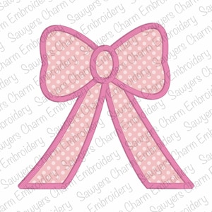 Puede incluir: Un lazo rosa con lunares blancos. El lazo está contorneado en un rosa más oscuro.