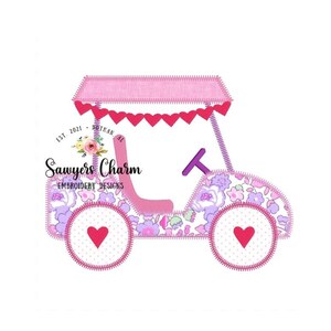 May include: Pink and purple applique design of a golf cart with a floral print and pink hearts. The cart has a pink canopy and a purple steering wheel. The text "Sawyers Charm Embroidery Designs" is included in the design.
