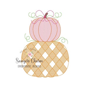 May include: A stacked pumpkin embroidery design with a pink pumpkin on top of a checkered pumpkin. The design is perfect for fall crafts and decorations.