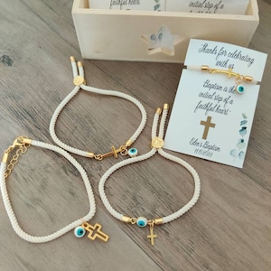 Pulsera de cruz y ojo malvado, recuerdos, navidad, souvenir de quinceañera, bautizo, primera comunión, regalos de boda