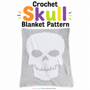 May include: A square crochet blanket featuring a white skull design centered on a light gray background. The text above the blanket reads Crochet Skull Blanket Pattern in colorful letters. The bottom text reads Lovable Loops Shop by Melissa Hassler.
