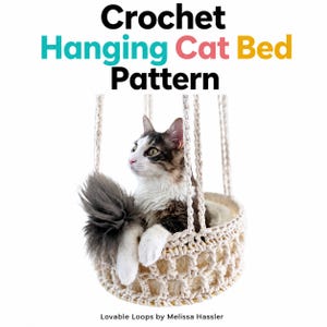 May include: A crochet hanging cat bed pattern featuring a brown and white cat sitting inside a cream-colored, circular, open-weave hanging basket. The text reads Crochet Hanging Cat Bed Pattern and Lovable Loops by Melissa Hassler.