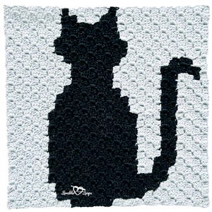 May include: A black cat silhouette crocheted in black yarn on a gray crocheted background. The crochet piece is square and has the text "Lovable Loops" in the bottom right corner.