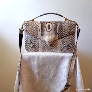 Vintage snakeskin handbag with top handle and detachable shoulder strap
