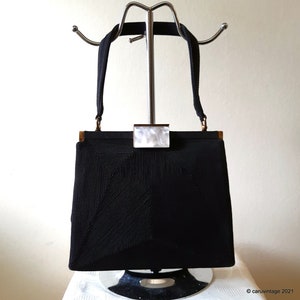 Genuine Corde black evening bag with mother of pearl effect lucite clasp