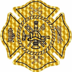 May include: A gold-colored Maltese cross design with a textured background. The center features a firefighter's helmet surrounded by tools, a rope border, and a fire hydrant. The cross arms have crossed axes and a ladder.