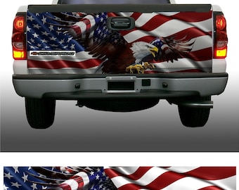 May include: A white pickup truck with a red, white, and blue American flag decal on the tailgate. The flag is waving in the wind and a bald eagle is flying over it. The truck has the word "SILVERADO" on the tailgate.