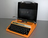 Silver Reed 200 orange , working vintage Japan typewriter, with case, new ribbon