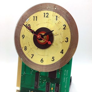 Computer Art Clock Hours on CD on circuit board